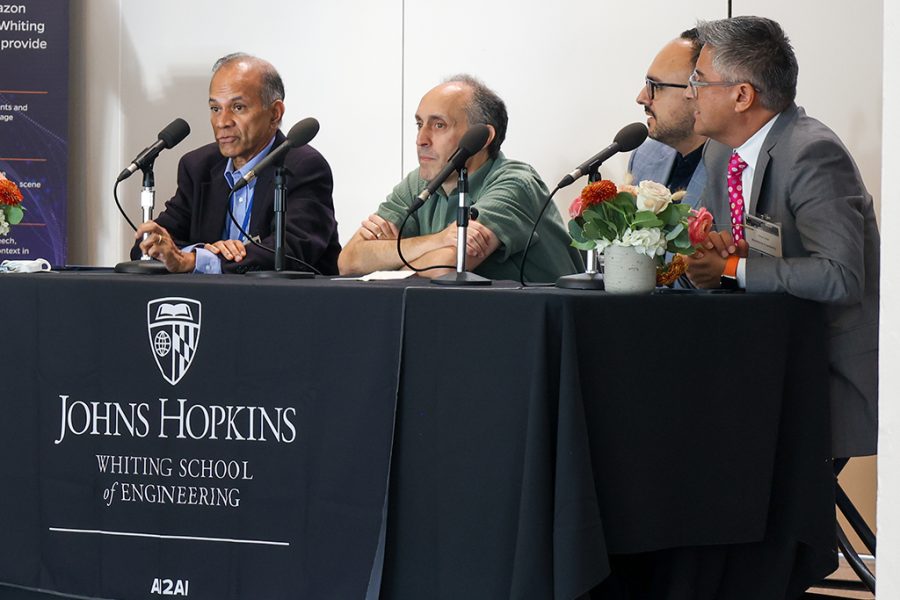 Rama Chellappa, Bloomberg Distinguished Professor, JHU; Jason Eisner, Professor, JHU; Ariya Rastrow, Senior Principal Scientist, Alexa AI; and Rene Vidal, Amazon Scholar and JHU Professor, sit at a panel onstage to discuss the potential and limitations of foundational models.